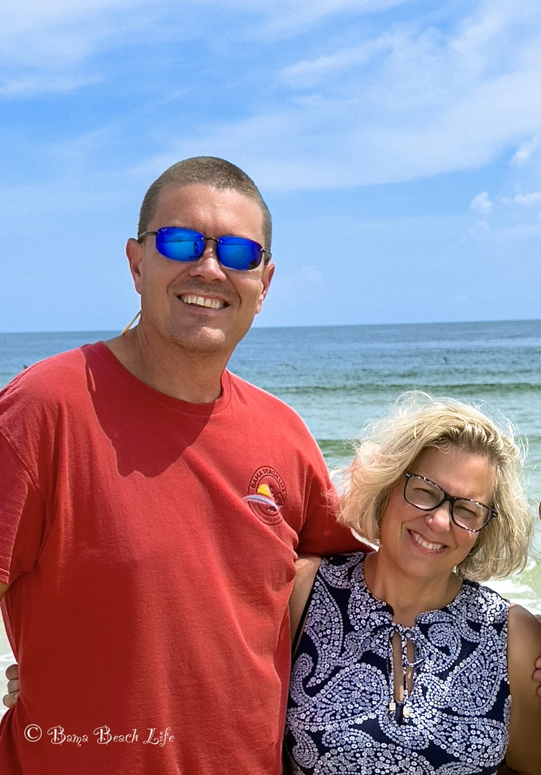 Mark Cactus Jack with his wife on the Alabama Gulf Coast, representing Bama Beach Photography in Gulf Shores and Orange Beach for legacy family portraits, yacht and marine photography, and coastal wall art.