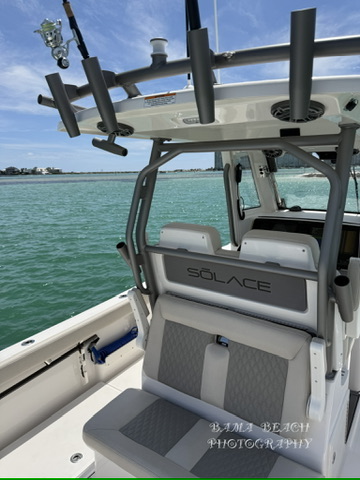 Center-console boat helm and seating photographed on clear coastal water near Orange Beach, Alabama.