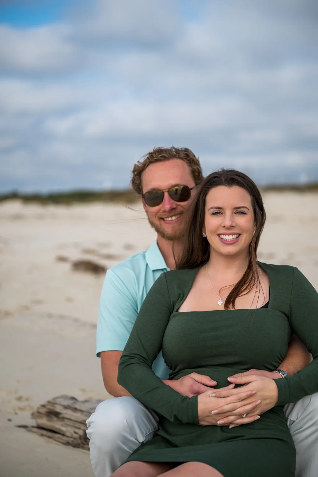 Guided beach portrait experience on the Alabama Gulf Coast with relaxed posing, natural connection, and professional coastal photo editing.